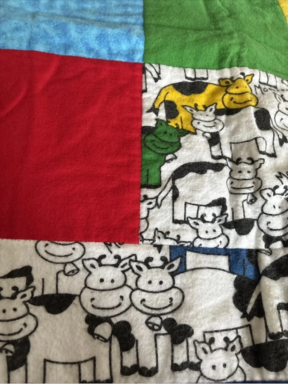 Multi-Color Patchwork Cow Print Baby Quilt - Red, Yellow, Blue, Green